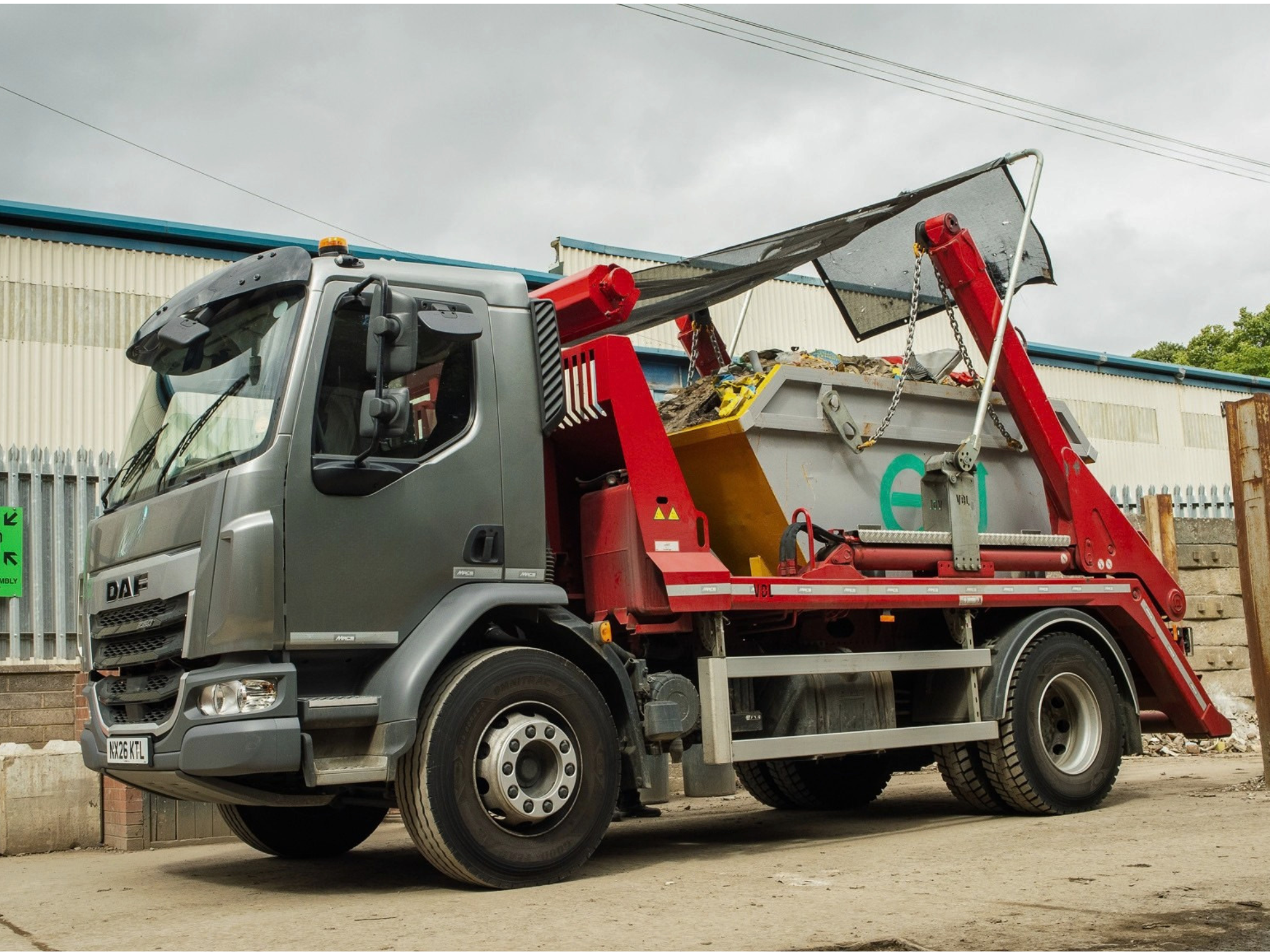 A skiploader truck available to rent and hire